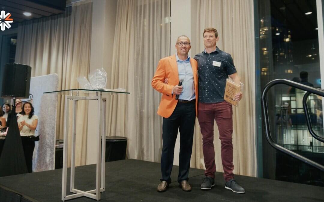 TEEMA's orange jacket sales award presented to a top-performing member